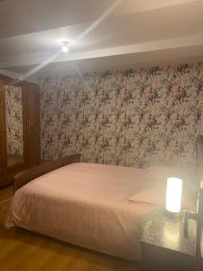 Łóżko lub łóżka w pokoju w obiekcie La Chambre d'Angèle