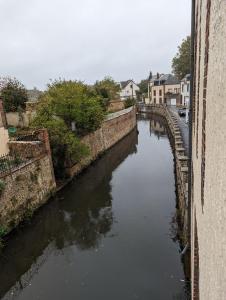 a view of a river from a bridge at Duplex de 65 m2, Cœur de Bonneval in Bonneval