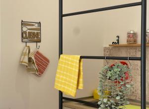 a towel rack with towels on it next to a fireplace at Attico Al Vomero in Naples +75 photos