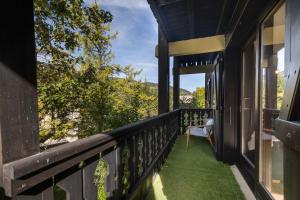 a balcony with a view of the mountains at Appartement Uccelli - Cocoon just a stone's throw from the centre of Megève in Megève