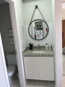 a bathroom with a sink and a mirror at Travellar Spot 1225A in Ribeirão Preto +19 photos