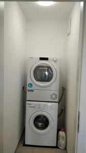 a washer and dryer in a small room at Sroom Metzingen in Metzingen