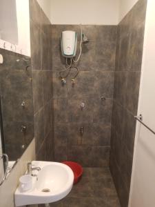 a bathroom with a toilet and a sink at Pangani Oasis Gem 2-BR Stylish Apartment in Nairobi
