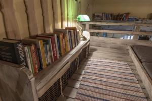 a room with a bunch of books on a shelf at Apartmány na Trojici - DOLNÝ apartmán in Banská Štiavnica