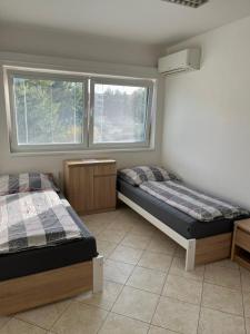 Postel nebo postele na pokoji v ubytování Ubytování Pardubice Trnová