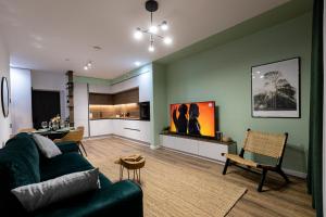 a living room with a couch and a table at Hedarom in Sinaia +11 photos