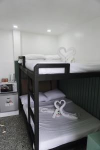two sets of bunk beds with hearts on them at Cebu Backpackers Hostel in Cebu City