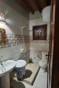 a bathroom with a toilet and a sink at Studio house in Tunis