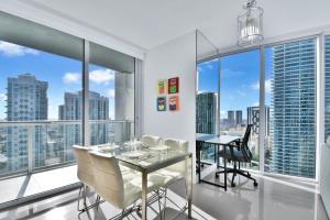a dining room with a view of the city at Amazing 2 Bedroom at Icon in the Heart of Brickell in Miami