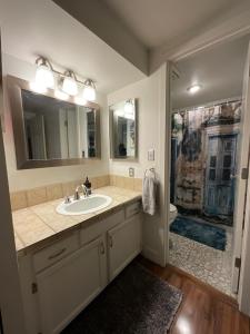 a bathroom with a sink and a shower at Larimer Square, Parking included, at The Windsor in Denver +13 photos