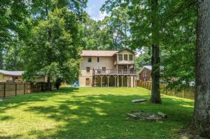 a large house with a yard with trees at Atlanta Forest Sanctuary home in Atlanta +54 photos