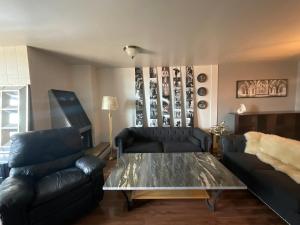 a living room with a couch and a coffee table at Larimer Square, Parking included, at The Windsor in Denver