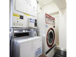 a laundry room with a washer and a dryer at Hotel Shinjukuya - Vacation STAY 74754v in Machida