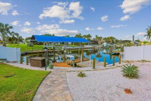 a view of a marina with a blue canopy at Royal Blue Dreams flexible rental near Anna Maria Island in Bradenton