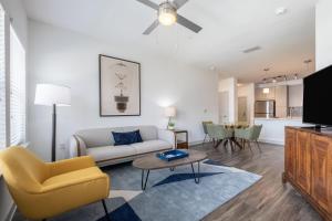 a living room with a couch and a table at Grady Square 1 Bedroom in Tampa
