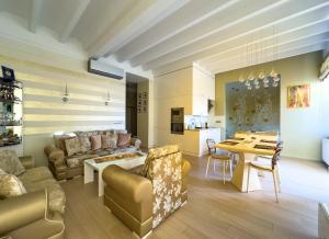 a living room with a couch and a table at Apartament Cesarski in Cieszyn