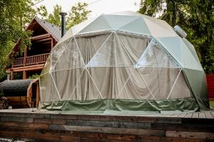 a large tent sitting on top of a house at Glamping Meleček in Opava