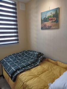 A bed or beds in a room at Se arrienda departamento en la ciudad de Chillán