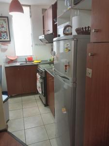 A kitchen or kitchenette at Se arrienda departamento en la ciudad de Chillán