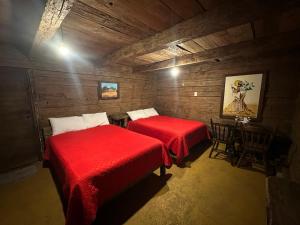 Postel nebo postele na pokoji v ubytování Cabañas Del Valle