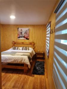 Postel nebo postele na pokoji v ubytování Pucón Rec-Lodge