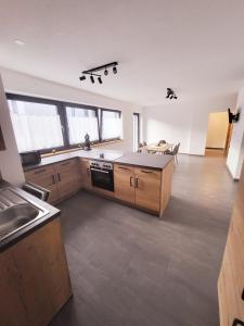 a kitchen with wooden cabinets and a counter top at Bergblick Wohnung Posch in Imst