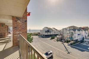 a balcony of a house with a car on the street at Ocean City Condo - Steps to Beach! in Ocean City
