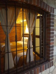 a window with two beds in a room at Hotel Santa Irene in Cholula