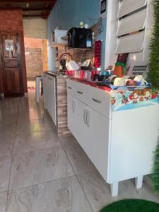 a kitchen with a sink and a counter top at Hostel Carol in Boa Vista