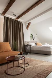 a living room with a couch and a coffee table at Apartman Kaptol in Zagreb