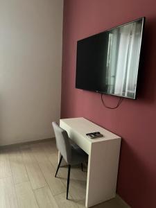 TV a/nebo společenská místnost v ubytování La Piazzetta Anzio