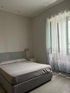 Postel nebo postele na pokoji v ubytování La Piazzetta Anzio
