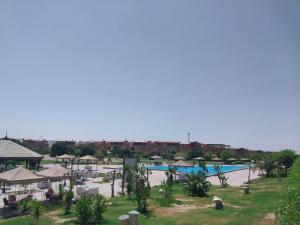 a view of a pool at a resort at jenylyn`s chalet` families only` in Ain Sokhna