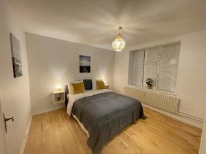 a bedroom with a large bed in a room at aday - Large terrace and 2 bedrooms apartment in the heart of Randers in Randers