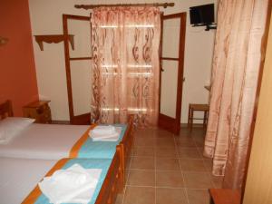 Posteľ alebo postele v izbe v ubytovaní Violetta Studios & Apartments