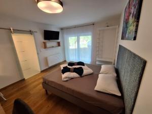 Posteľ alebo postele v izbe v ubytovaní Flataid Gästehaus Graschi - Steinbergstraße