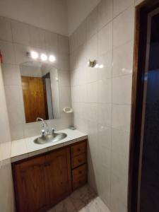 a bathroom with a sink and a mirror at Casa San Lucas in San Rafael