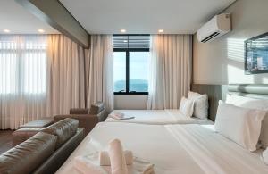 เตียงในห้องที่ Blue Tree Premium Florianópolis