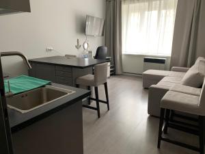Televízia a/alebo spoločenská miestnosť v ubytovaní APARTMEN PRAHA