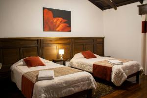 Postel nebo postele na pokoji v ubytování Chuquiragua Lodge & Spa
