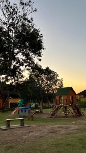 a park with a playground with a slide at Winterville flat 307 in Gravatá