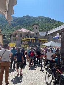 a crowd of people standing around in a street at la Montagnette L ours T1 in Moutiers