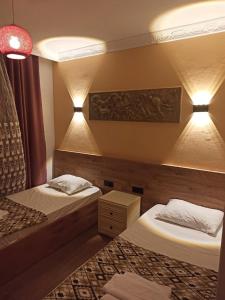 מיטה או מיטות בחדר ב-Agon Boutique Hotel
