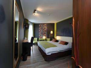 Postel nebo postele na pokoji v ubytování Hotel Myrtilles