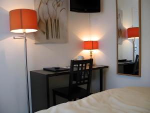 Postel nebo postele na pokoji v ubytování Hotel Myrtilles