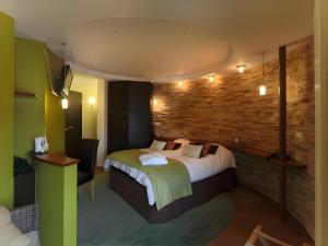 Postel nebo postele na pokoji v ubytování Hotel Myrtilles