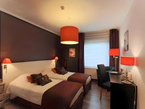 Postel nebo postele na pokoji v ubytování Hotel Myrtilles