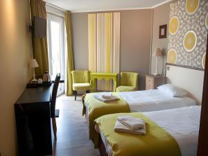 Postel nebo postele na pokoji v ubytování Hotel Myrtilles
