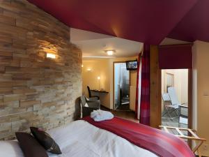 Postel nebo postele na pokoji v ubytování Hotel Myrtilles