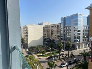 a view from a window of a city with buildings at Apparemment à côté du corniche au parc in Mohammedia